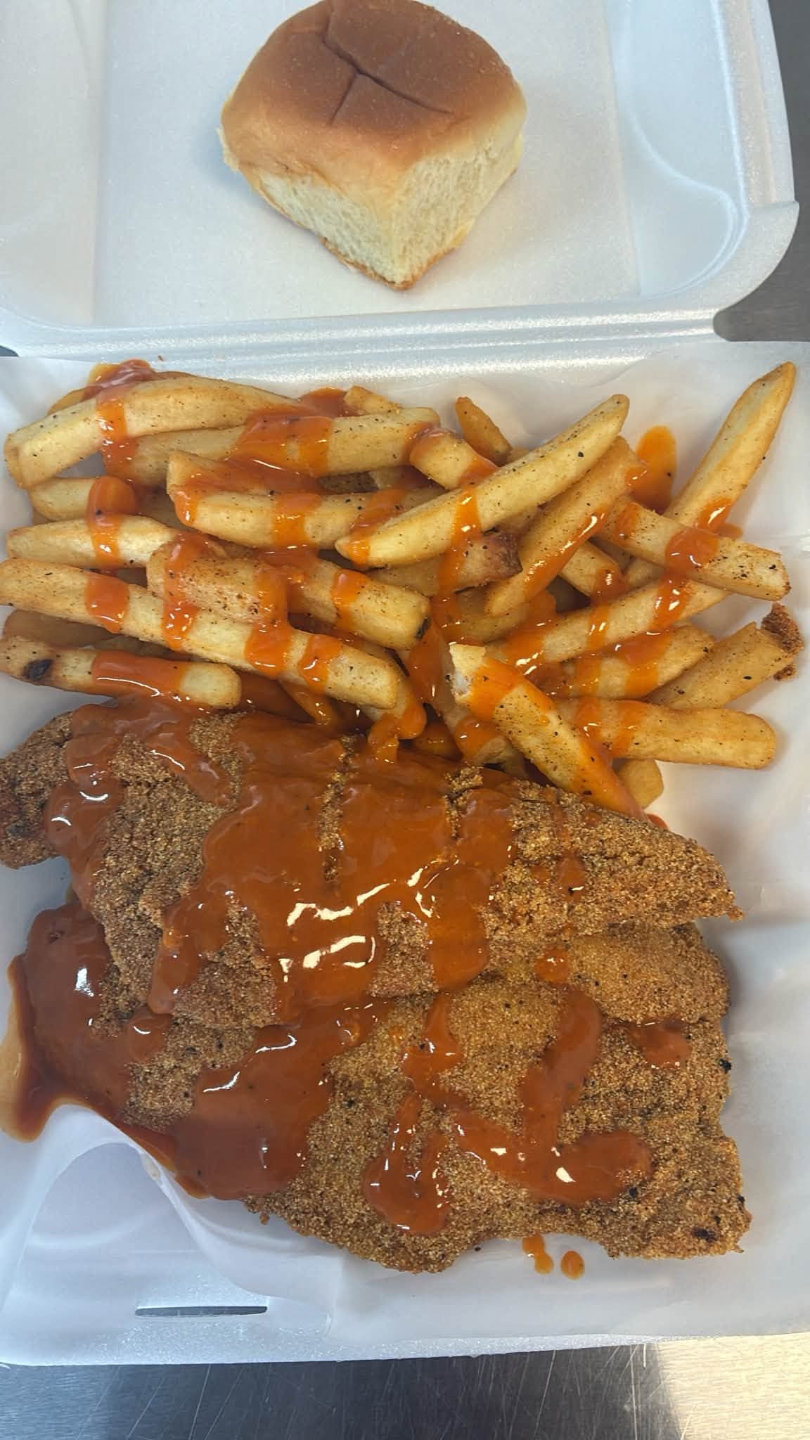 Crispy tenders, fries and a roll from The Chicken Box